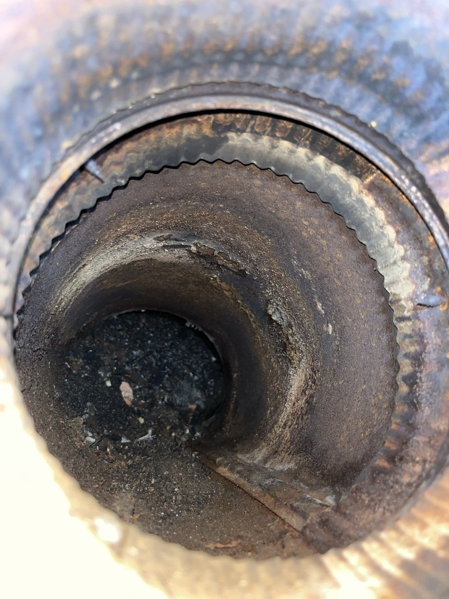 Heavy creosote buildup inside chimney flue before cleaning