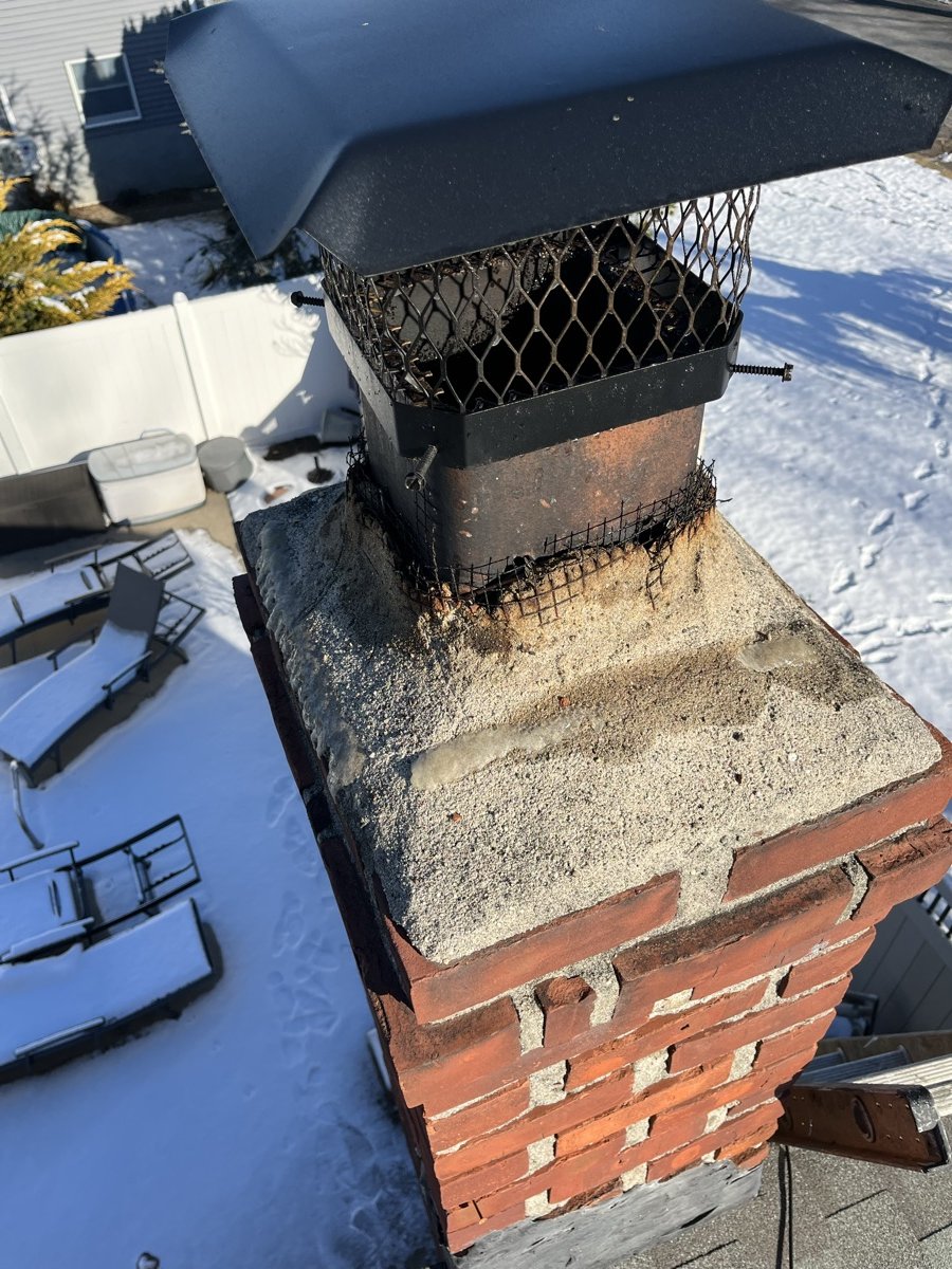 Damaged chimney crown before Capstone repair