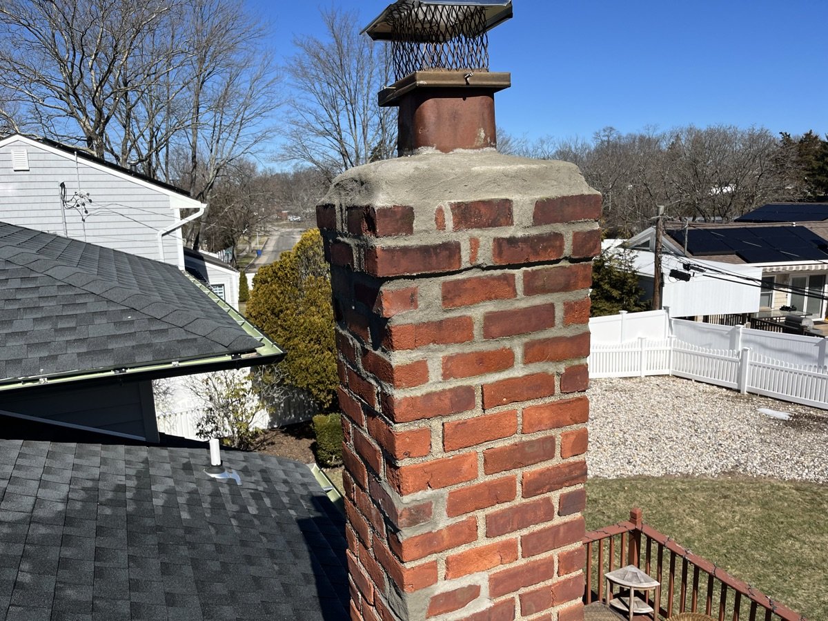 Rebuilt chimney with new cap after Capstone restoration