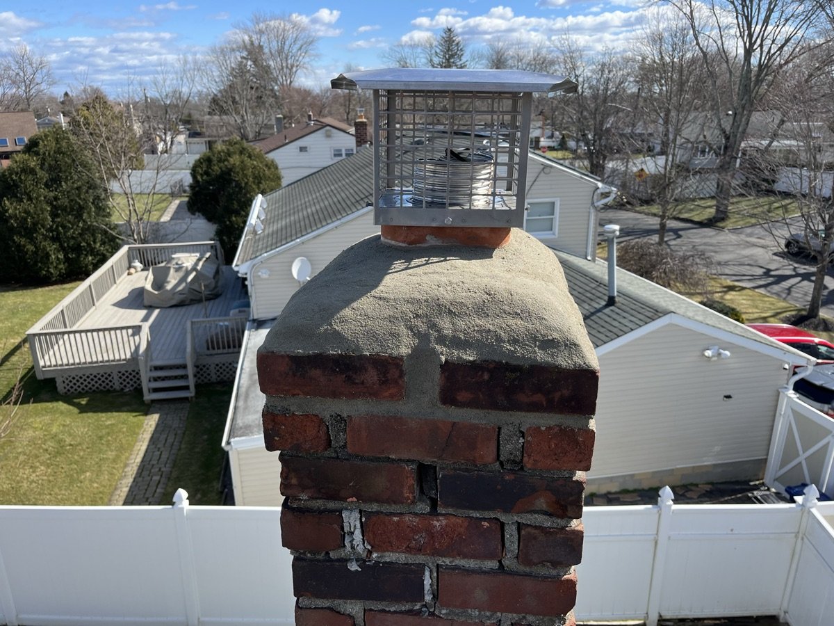 New chimney cap installed on restored crown