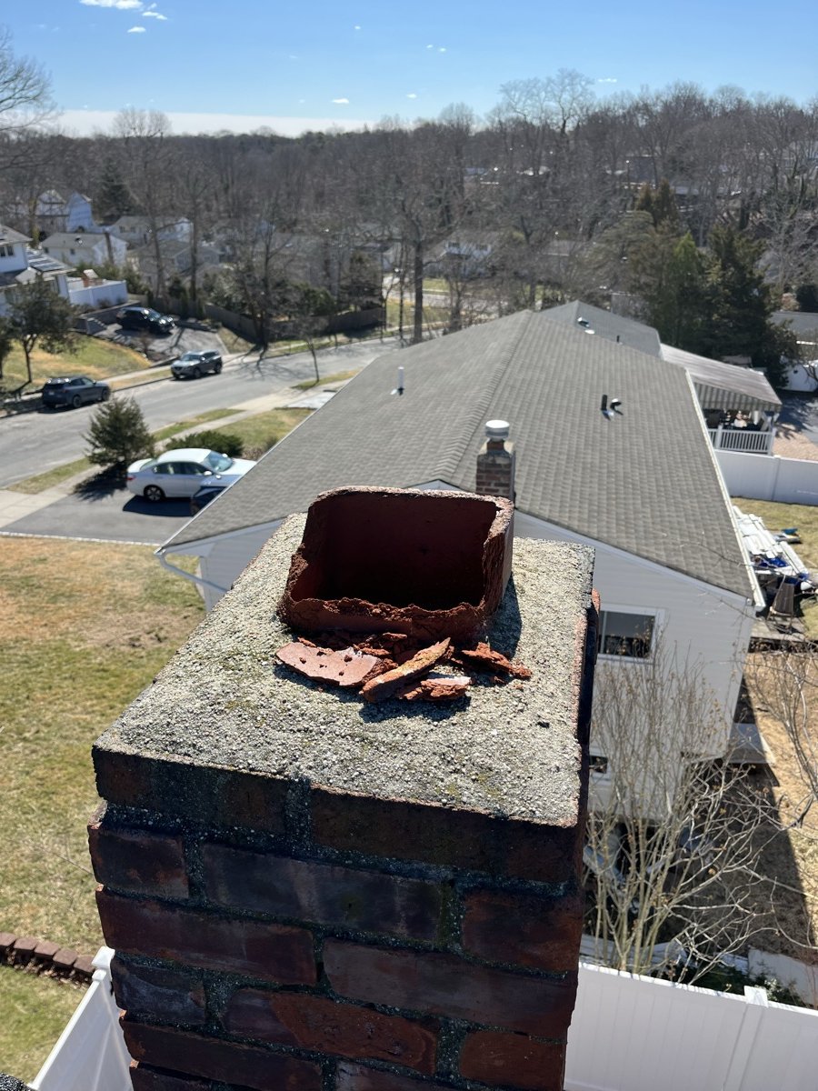 Deteriorated chimney before cap installation
