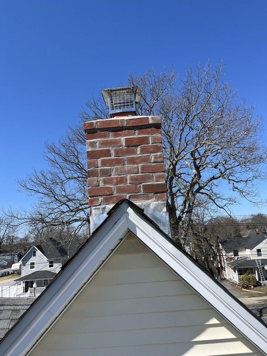 Tall clean chimney after complete rebuild by Capstone